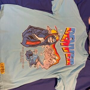 Light blue Graphic T-shirt, Worn 8-9 times. Very nice rich material